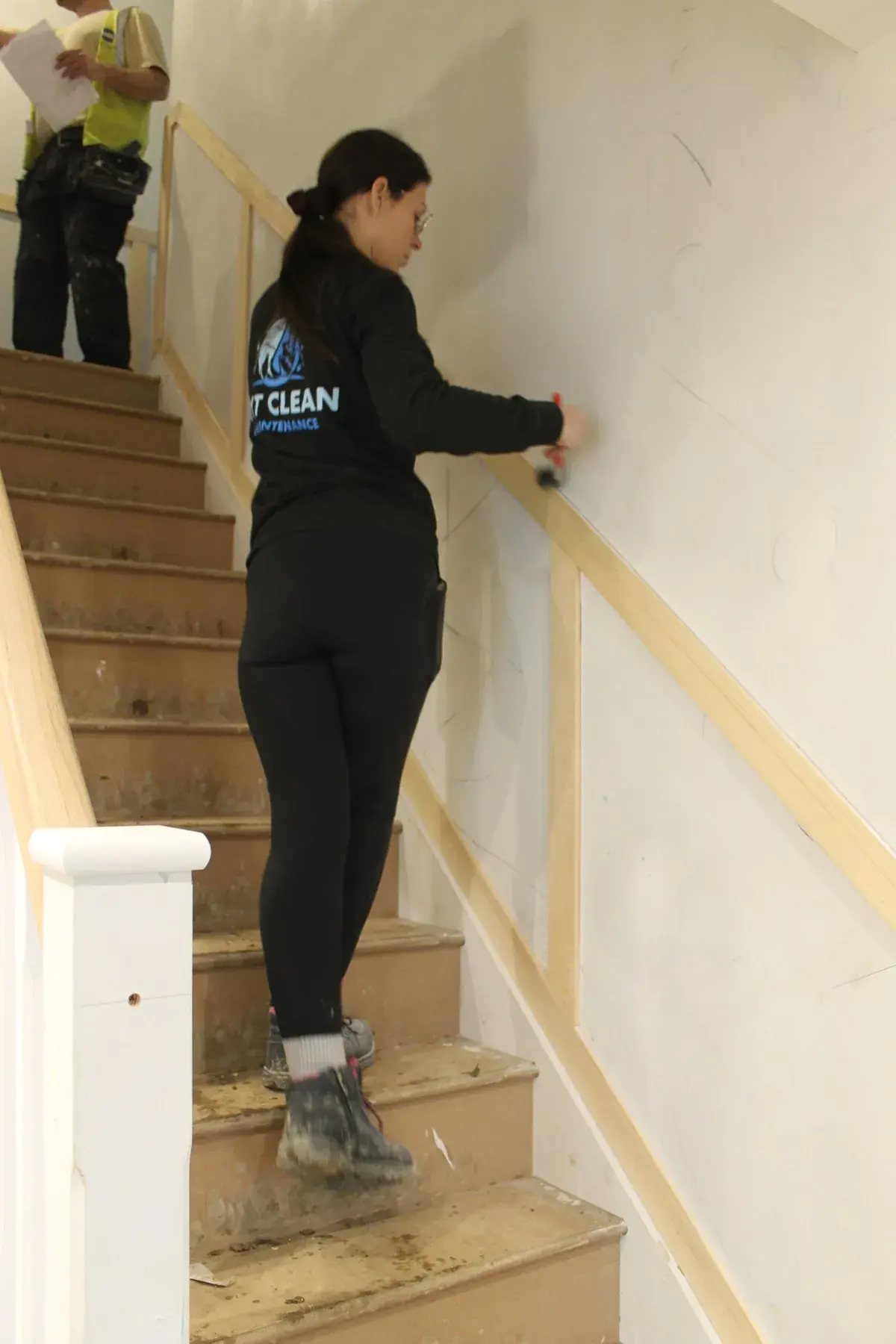 A MyT Clean cleaner wiping down a staircase in a new build