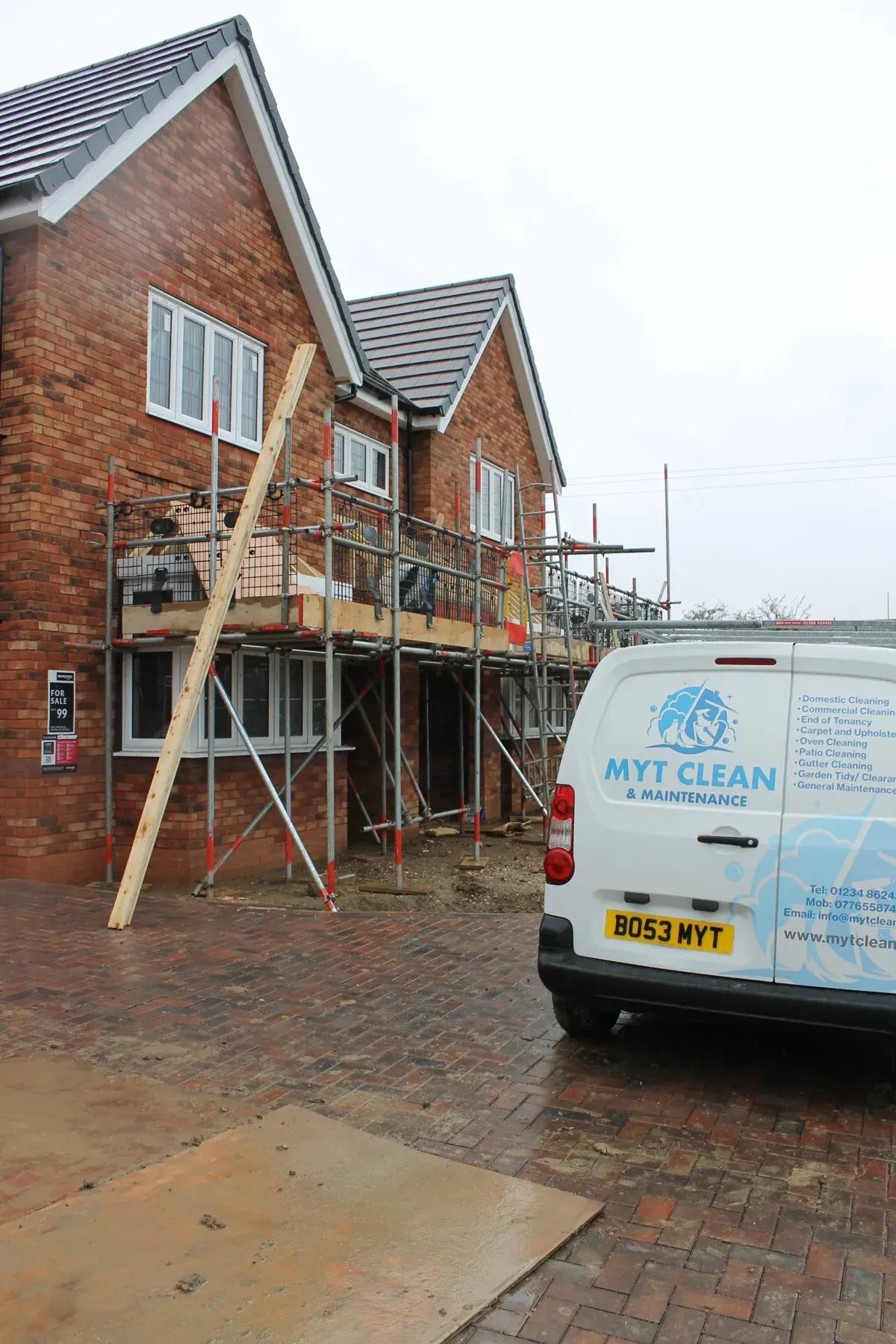 A branded MyT Clean van parked on a driveway in Bedford